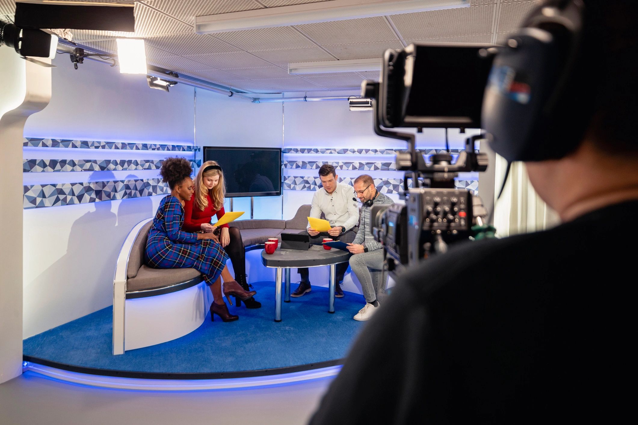 Studio production team preparing a recorded show