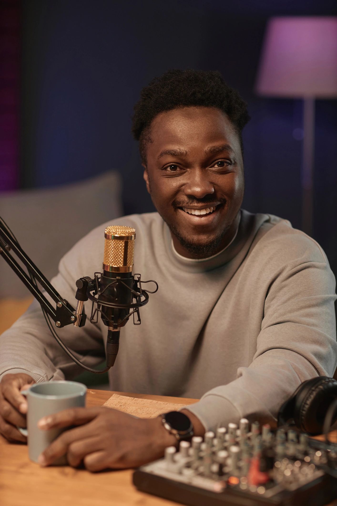 Podcaster smiling in a recording studio