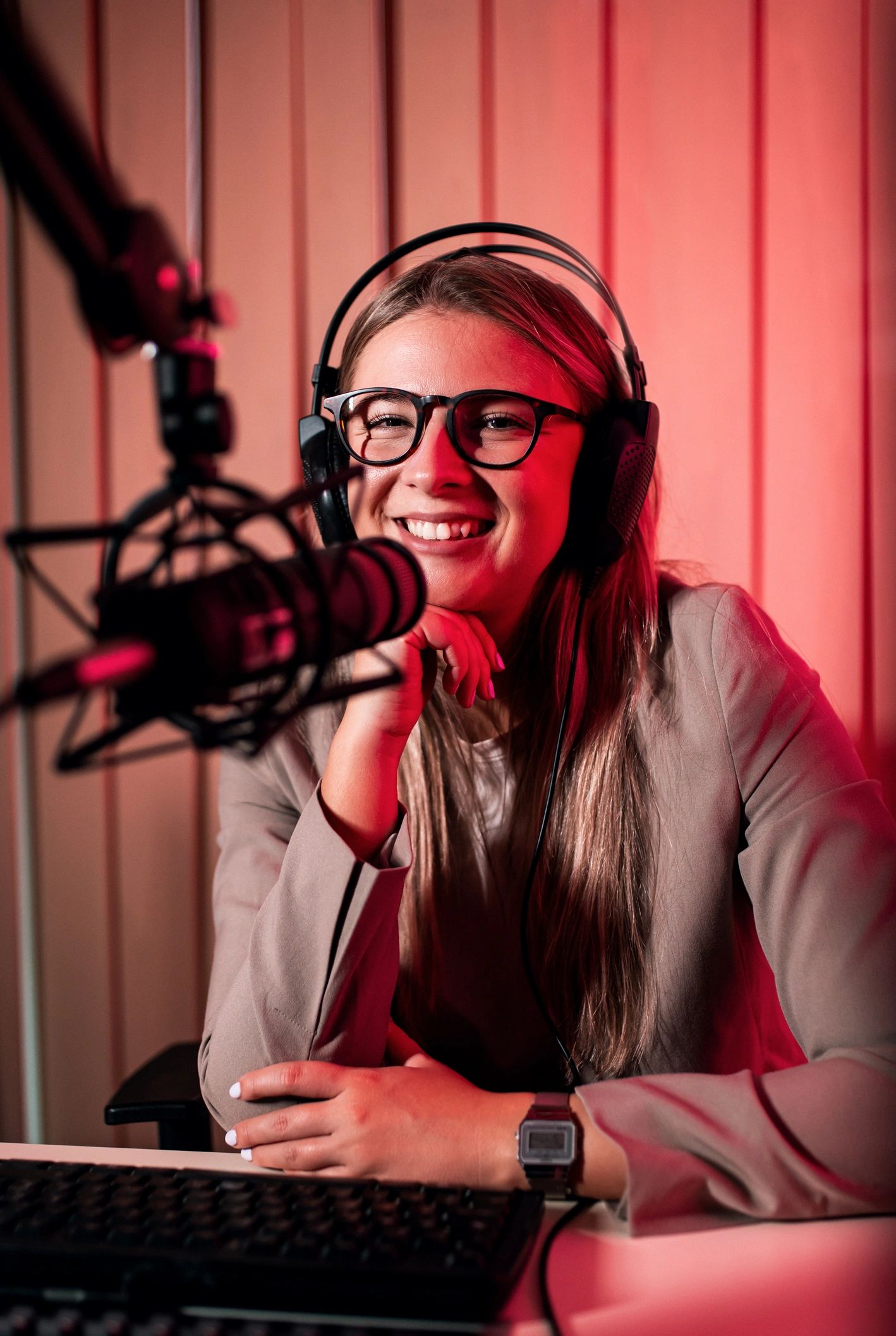 Female podcaster in a home studio