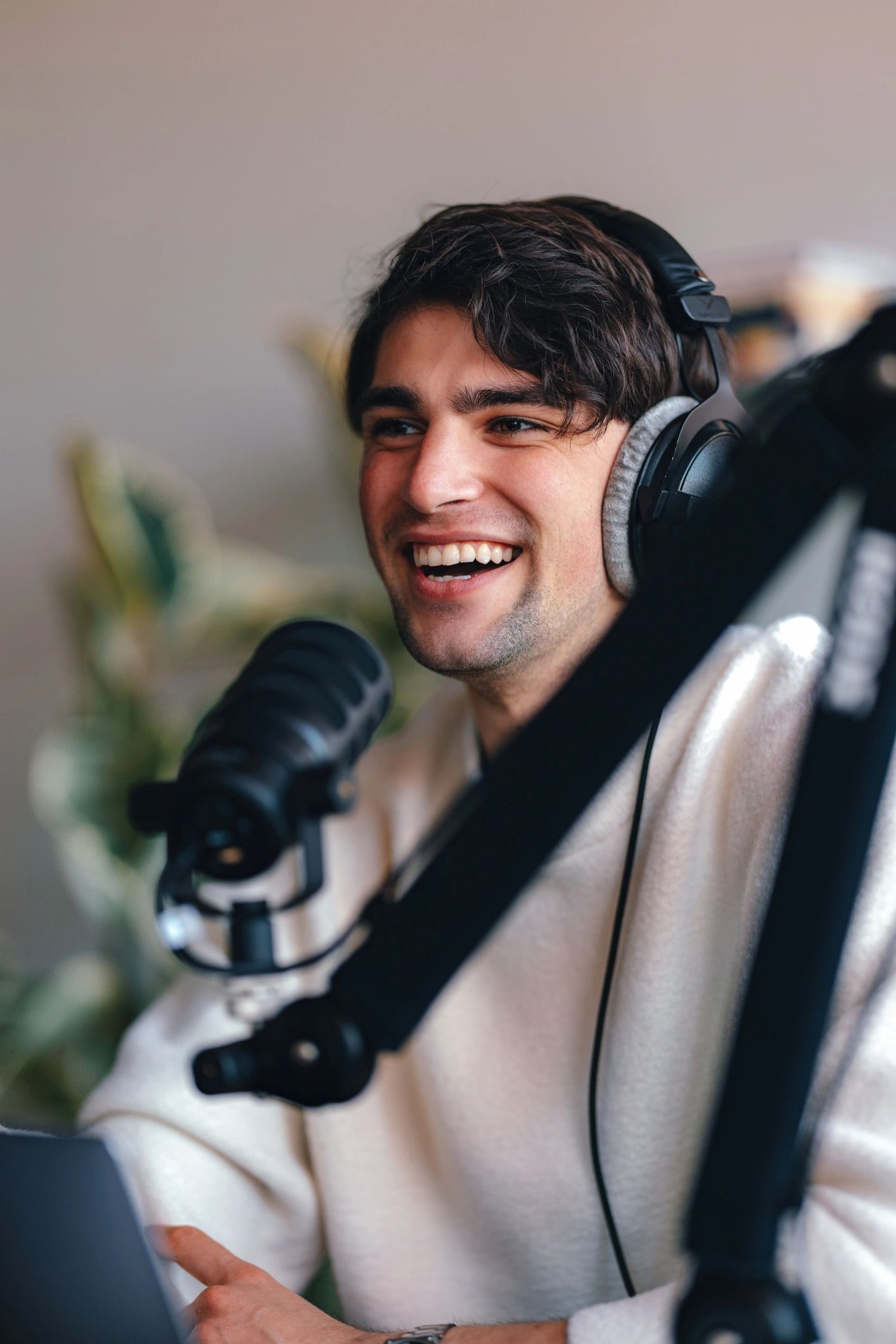 Male podcast host speaking into a microphone